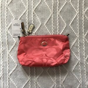 NWT Coach Signature Nylon Travel Pouch in coral with gold accents